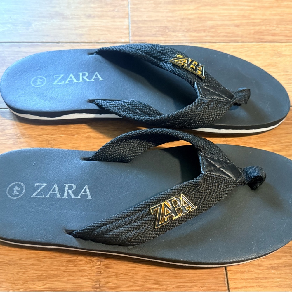 Zara Black Flip Flop Sandals with Gold Logo